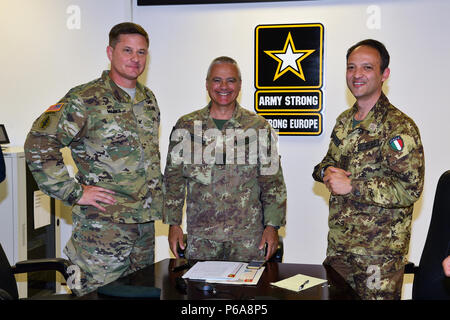 Colonel Steven M. Marks, commander United States Army Garrison Italy (left), Italian Army Colonel Federico Pognant Airassa, Public Information Officer Command of land forces operational “COMFOTER” (center), and Colonel Umberto D`Andria, Italian Base Commander Caserma Ederle (right), during the meeting media strategies in Caserma Ederle, Vicenza, Italy, May 31, 2016. Italian Army visit U.S. Army, in order to enhance to bilateral relations and to expand levels of cooperation and the capacity of the personnel involved in joint operations. (Photo by Visual Information Specialist Paolo Bovo/Release